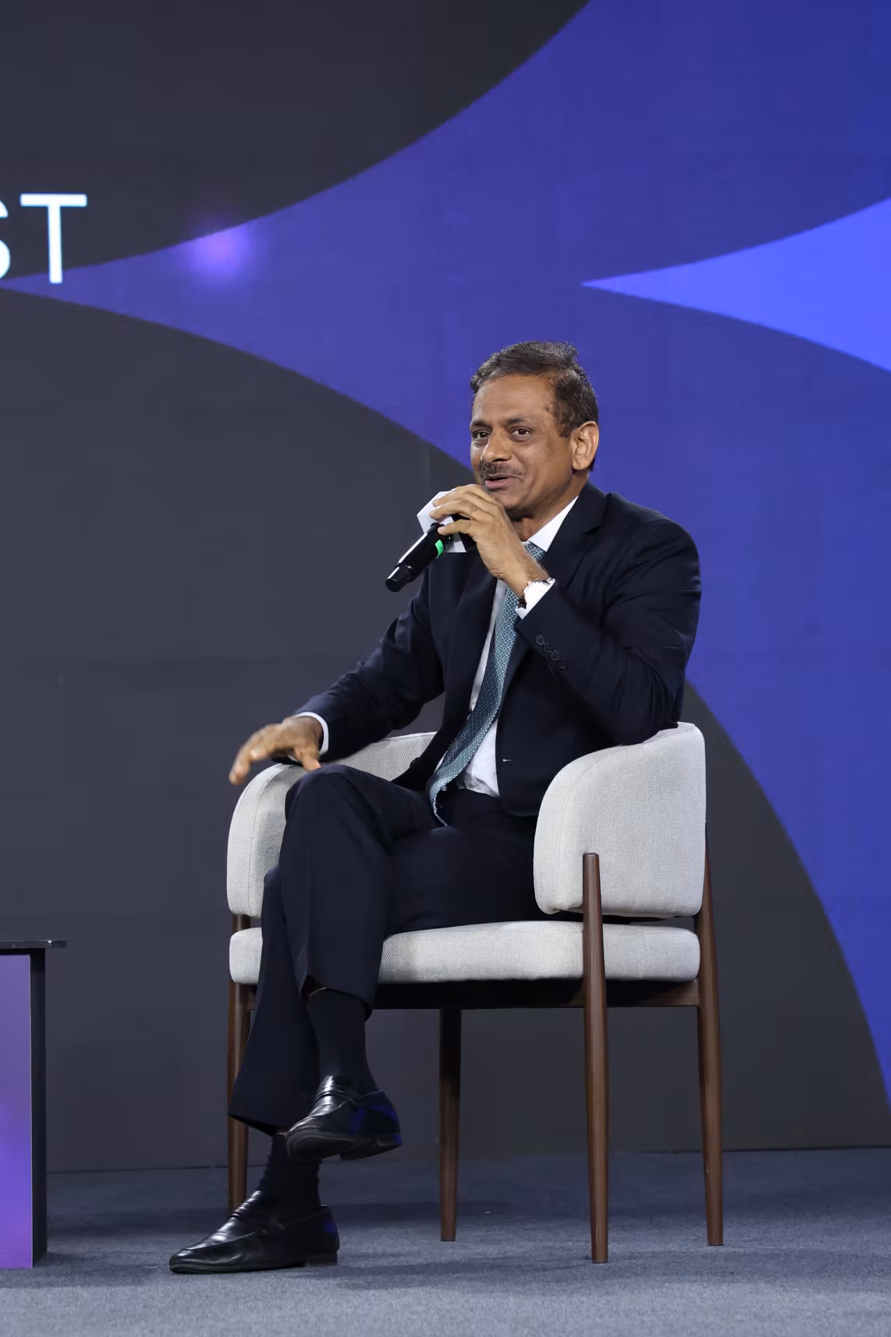 Leader speaking from the chair on stage